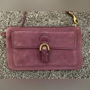 Coach pink suede wristlet.